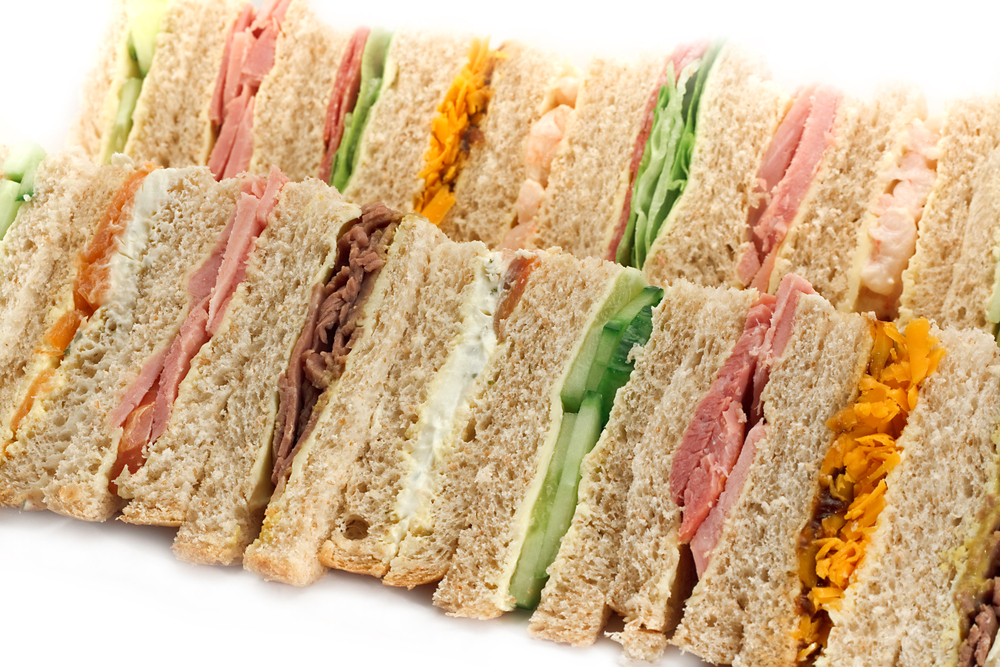 Rows,Of,Sandwiches,Made,With,Sliced,Bread,And,Cut,Into